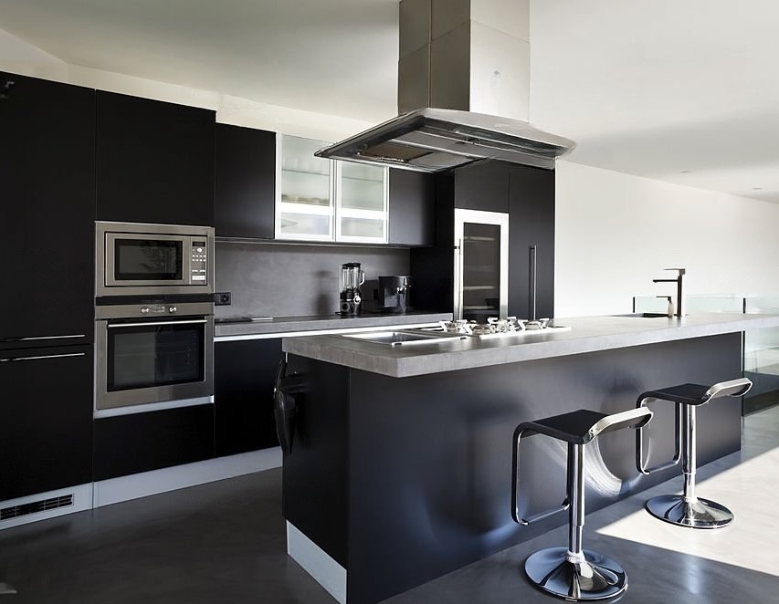 Sleek black cabinets paired with steel accents