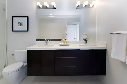 Modern bathroom remodeling with floating double vanity, large mirror, and minimalist design