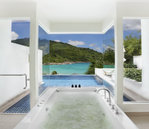 Luxury bathroom remodel featuring a whirlpool bathtub with panoramic ocean views and modern architectural design.